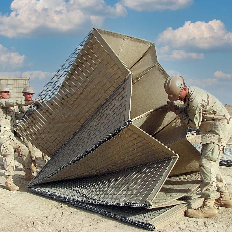 090411-N-8574M-025óHelmand Province, Afghanistanó11APR2009..Seabees assigned to Naval Mobile Construction Battalion (NMCB) 5 lift a HESCO barrier into alignment during a project. NMCB 5 is currently deployed to Afghanistan providing contingency construction support to allies and NATO International Security Assistance Force (ISAF). NMCB 5 is one of the Naval Expeditionary Combat Commands warfighting support elements providing host nation contingency construction support and security. U.S. Navy Photo by Mass Communication Specialist 2nd Class Patrick W. Mullen III.