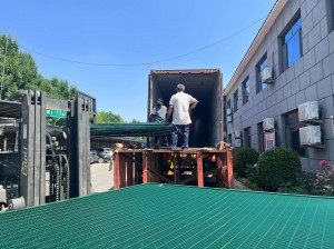 Loading of densely grained mesh containers